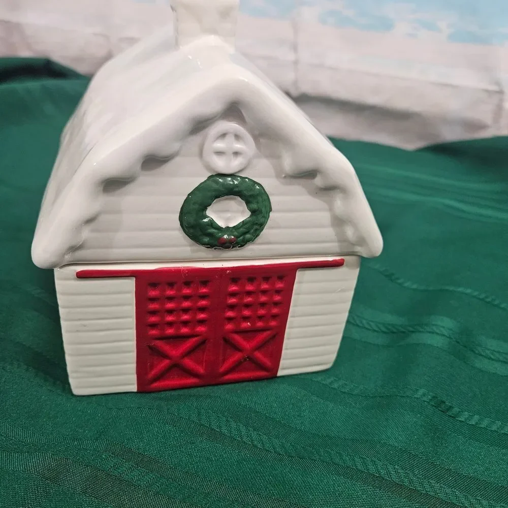 Cookie And Treat Jar In A Ceramic Barn with Red Doors And Green Wreath